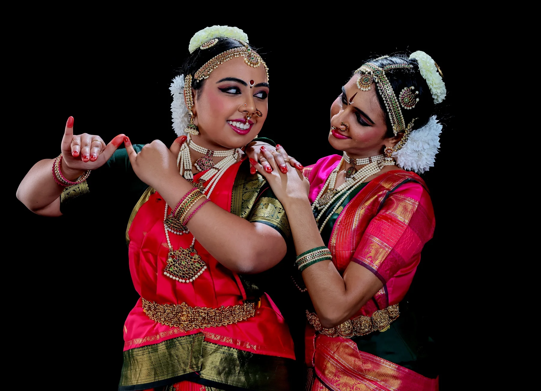 Shreya and Shriya in a synchronized duo pose for the Dhanashree Thillana